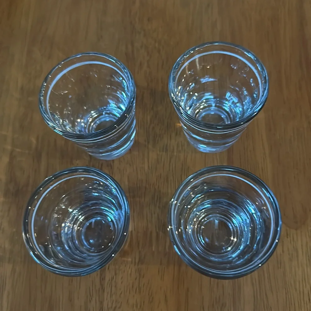 Anchor Hocking shot glasses. Clear with white stripe. Originally from Starbucks